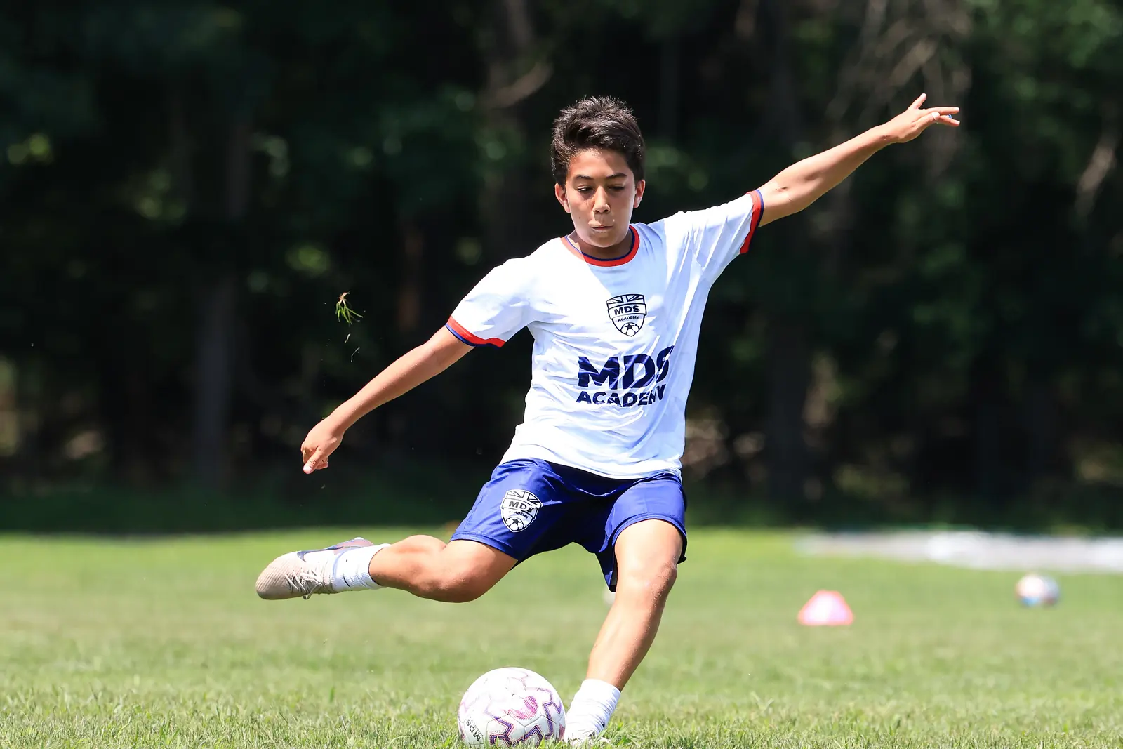 Youth soccer player striking the ball at an MDS Academy session in New Jersey