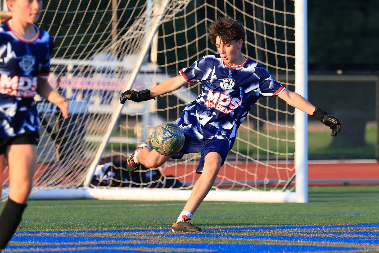 MDS Academy player volleying the ball at goal during elite soccer training in New Jersey