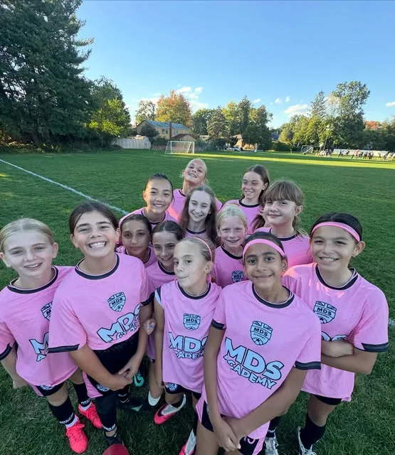 MDS Academy players in pink training kit