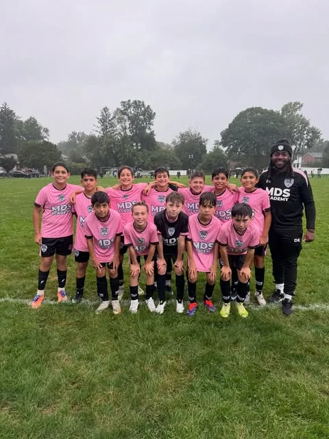 MDS Academy group with their coach