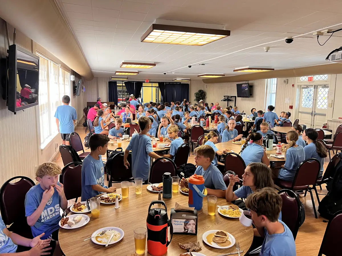 Campers eating together in the dining hall